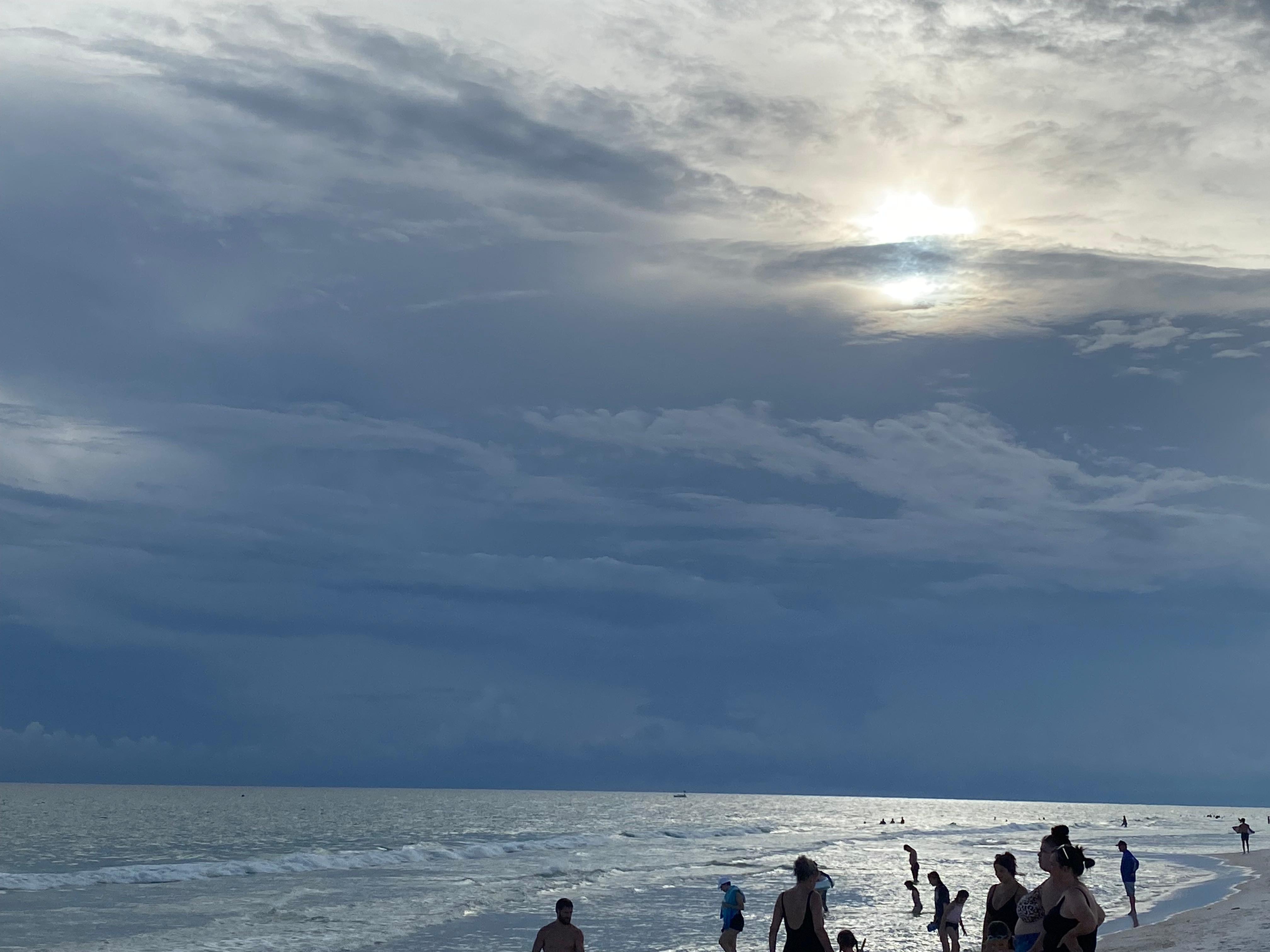 Beach at Top of the Gulf at sunset on a stormy night.