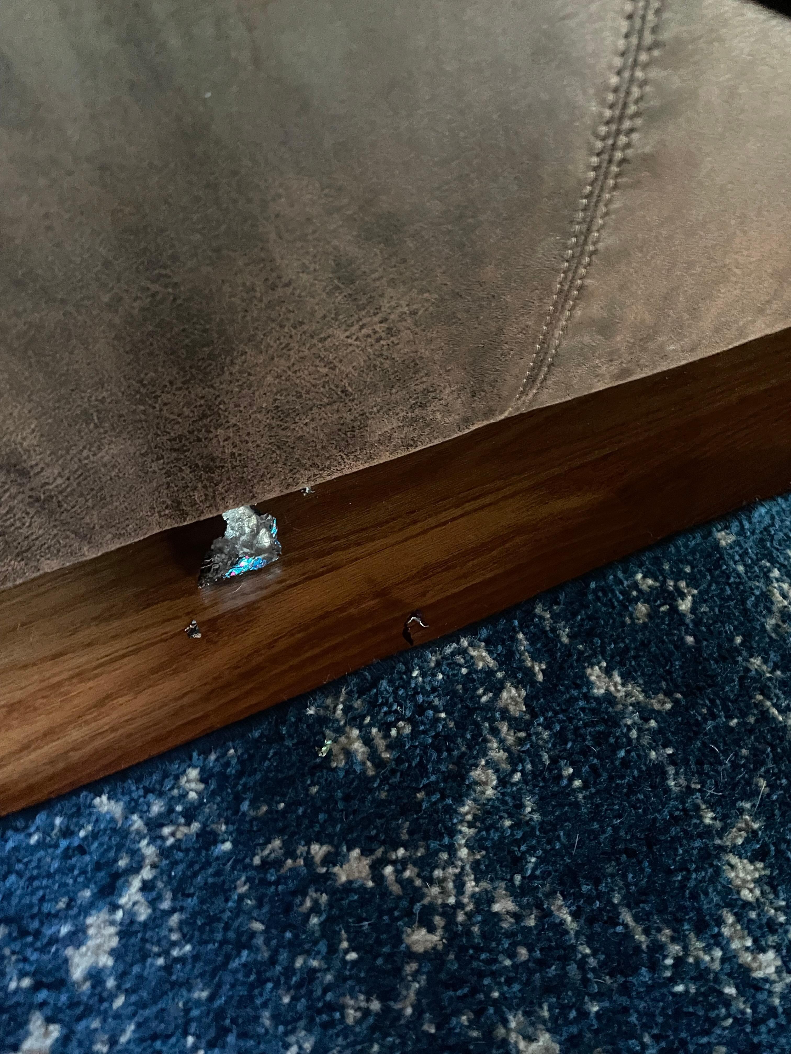 Trash on floor, cleaner was rushed and did not remove all of it.