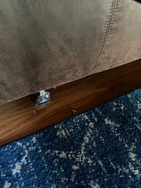 Trash on floor, cleaner was rushed and did not remove all of it.