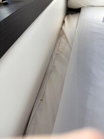 Looks like they do not clean the edge of the bed when they change the sheets