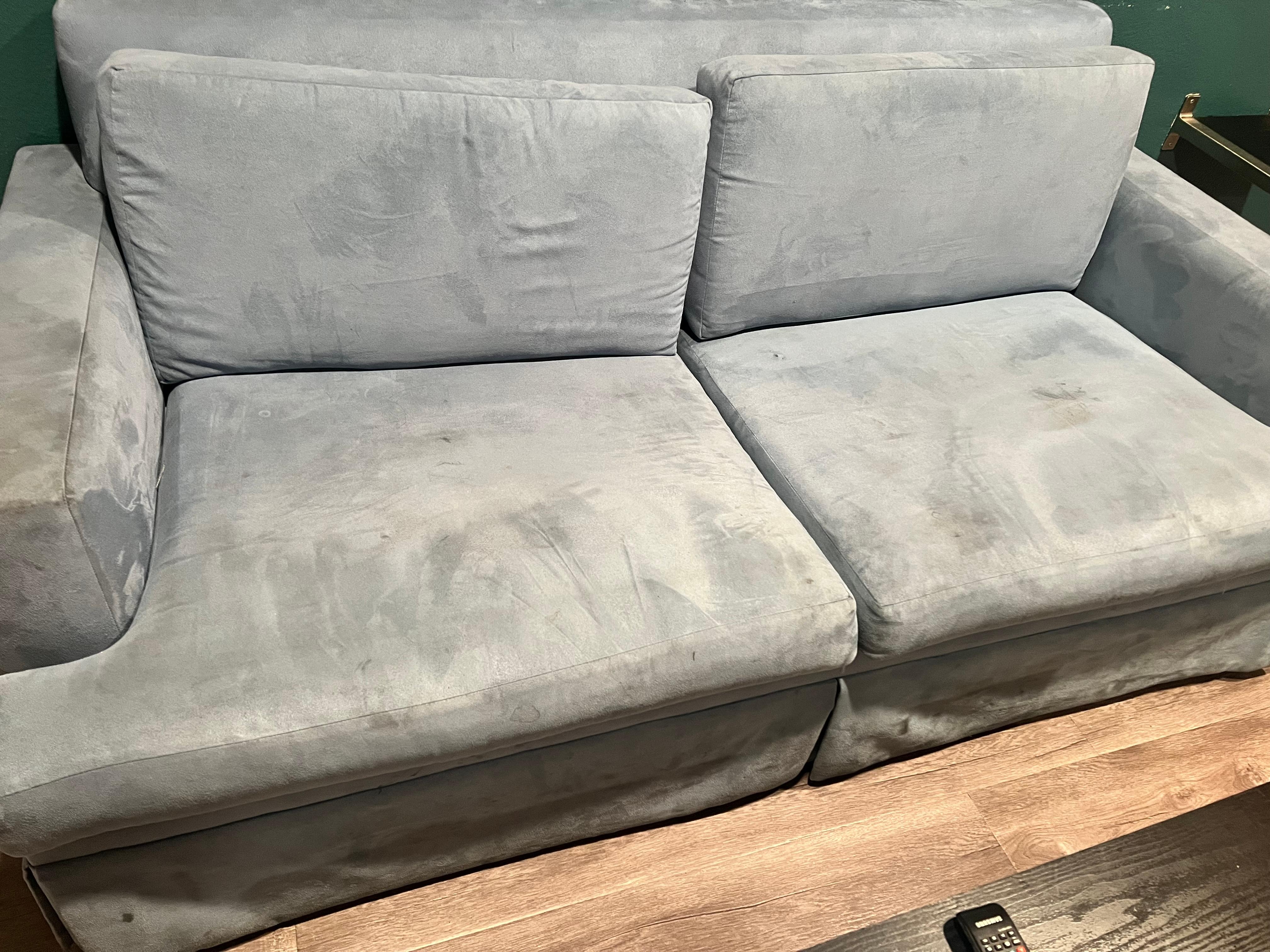 Stained sofa that had human hair on it