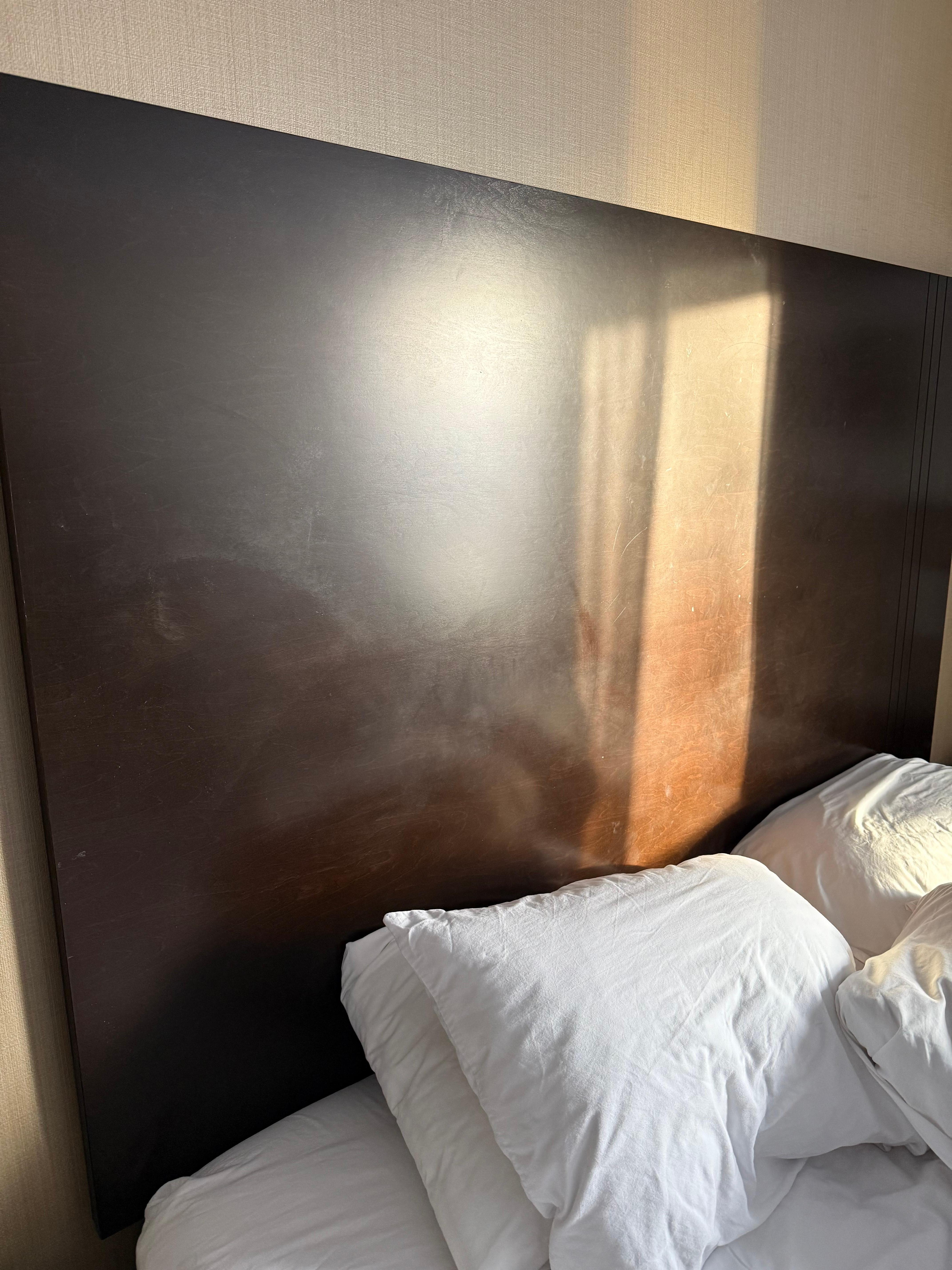 Gross headboard with fingerprints all over it 