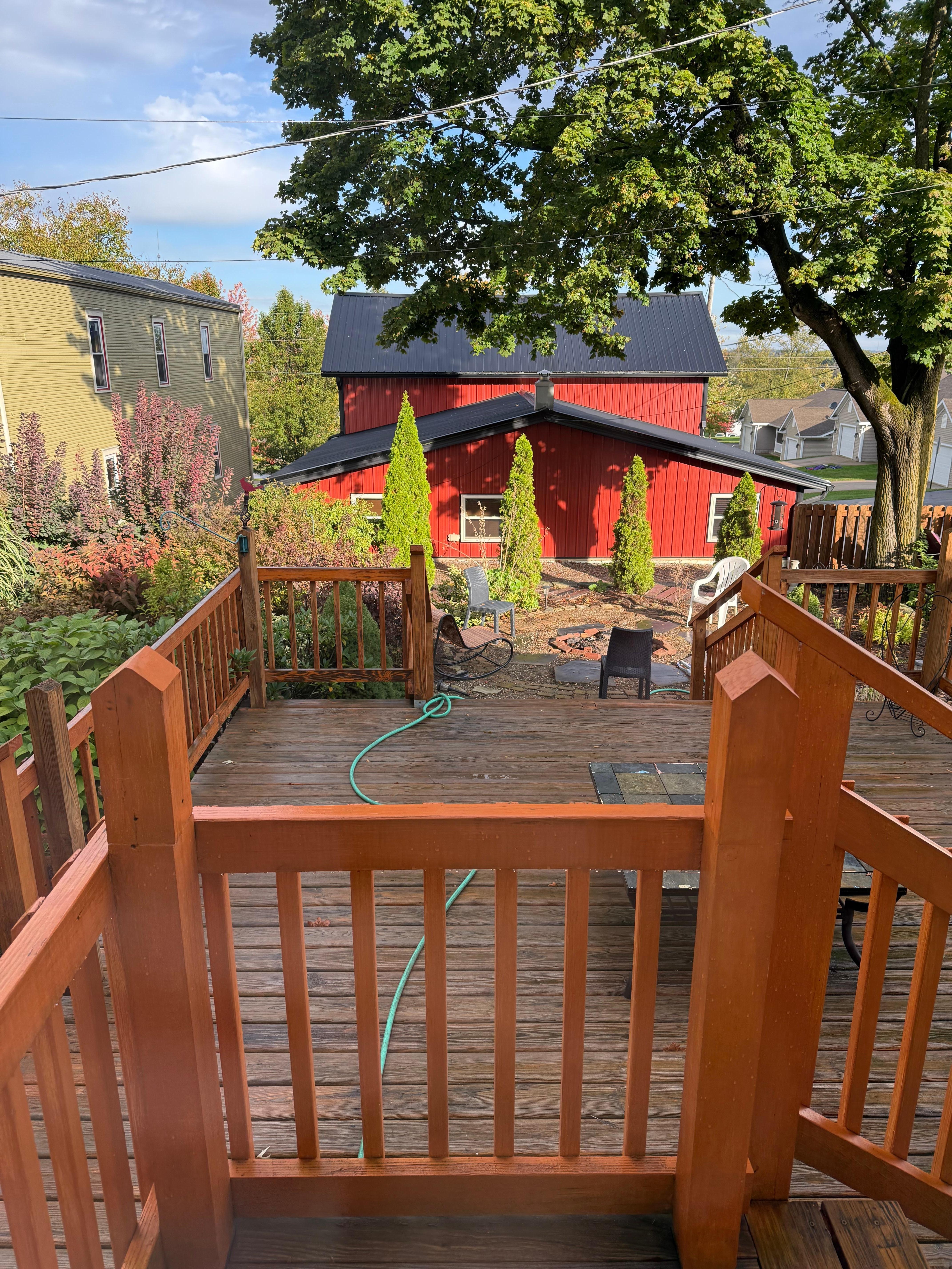 view from kitchen door, showing deck and guest house 
