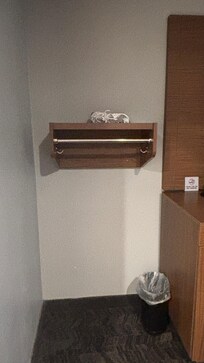 Blow dryer on shelf with no mirror or outlet