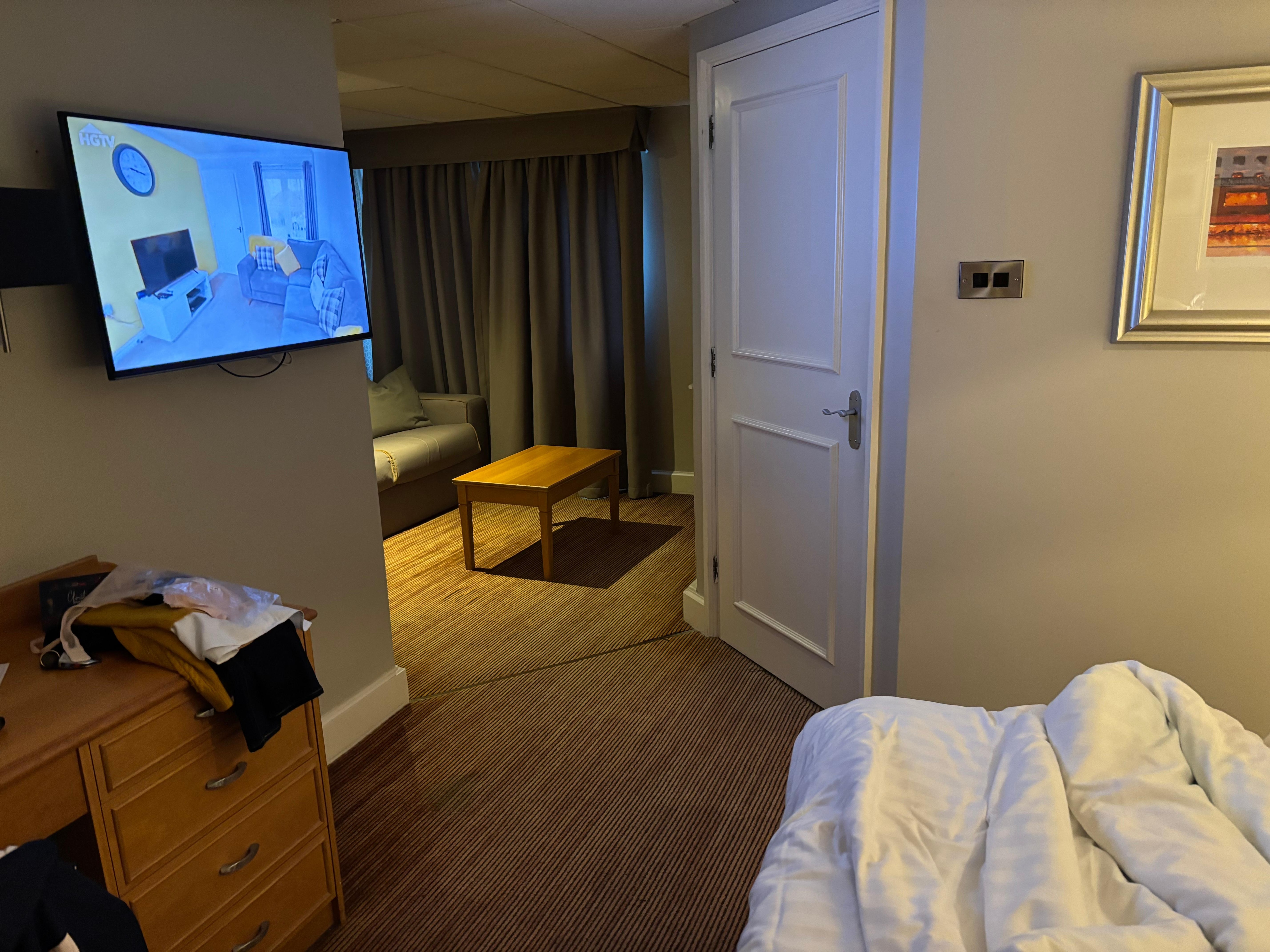 TV in front of the bed needs to be able to turn so you can watch it on the sofa or in bed