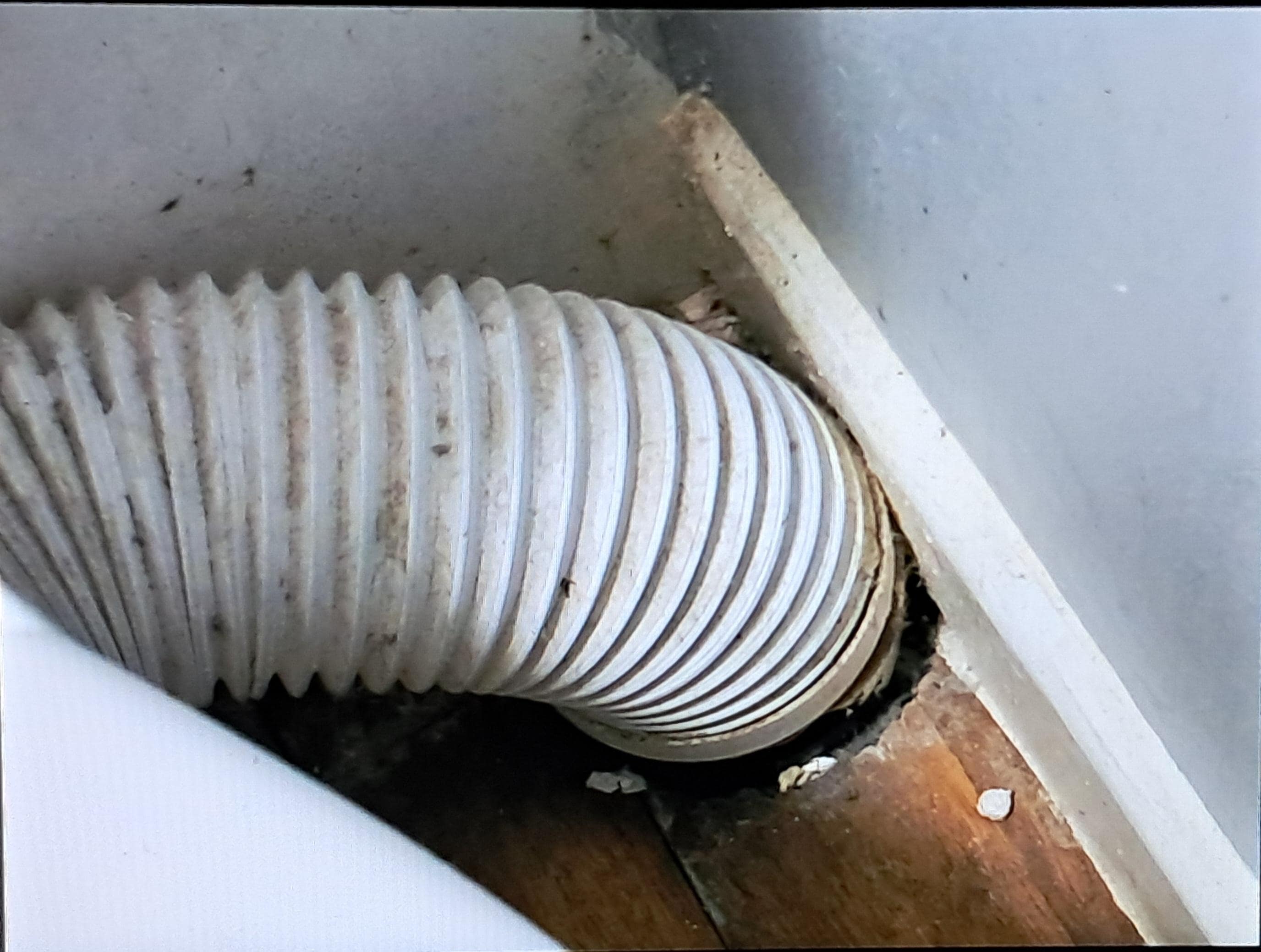 Corner of bathroom at the side of the toilet
