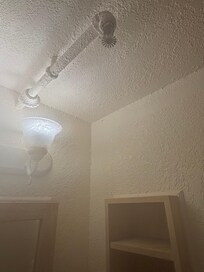 Spider webs, cracks down walls/paint.