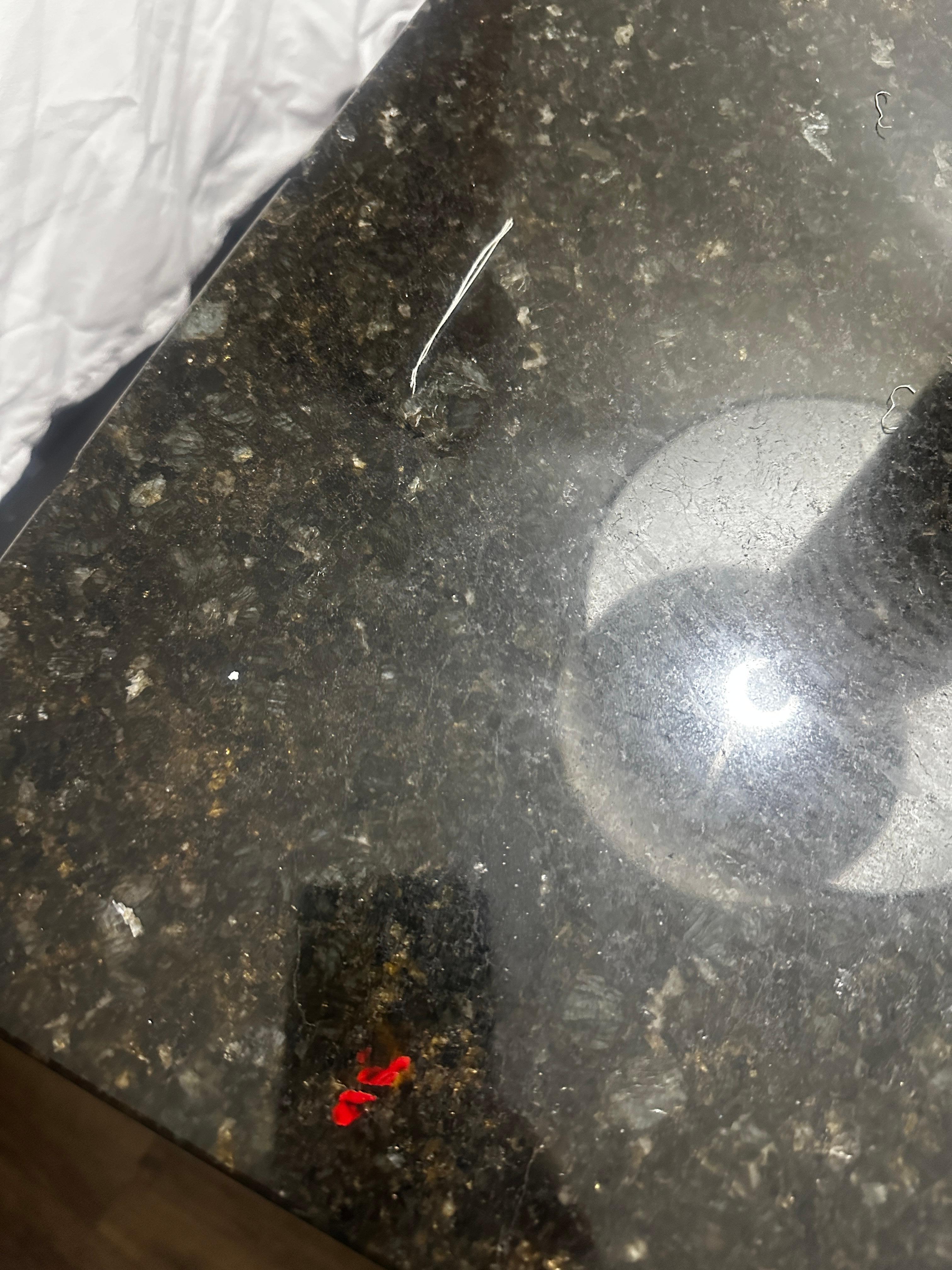 The side table was scratched and dusty 