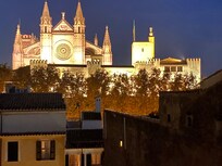 Roof terrace after dark with view cathedral.