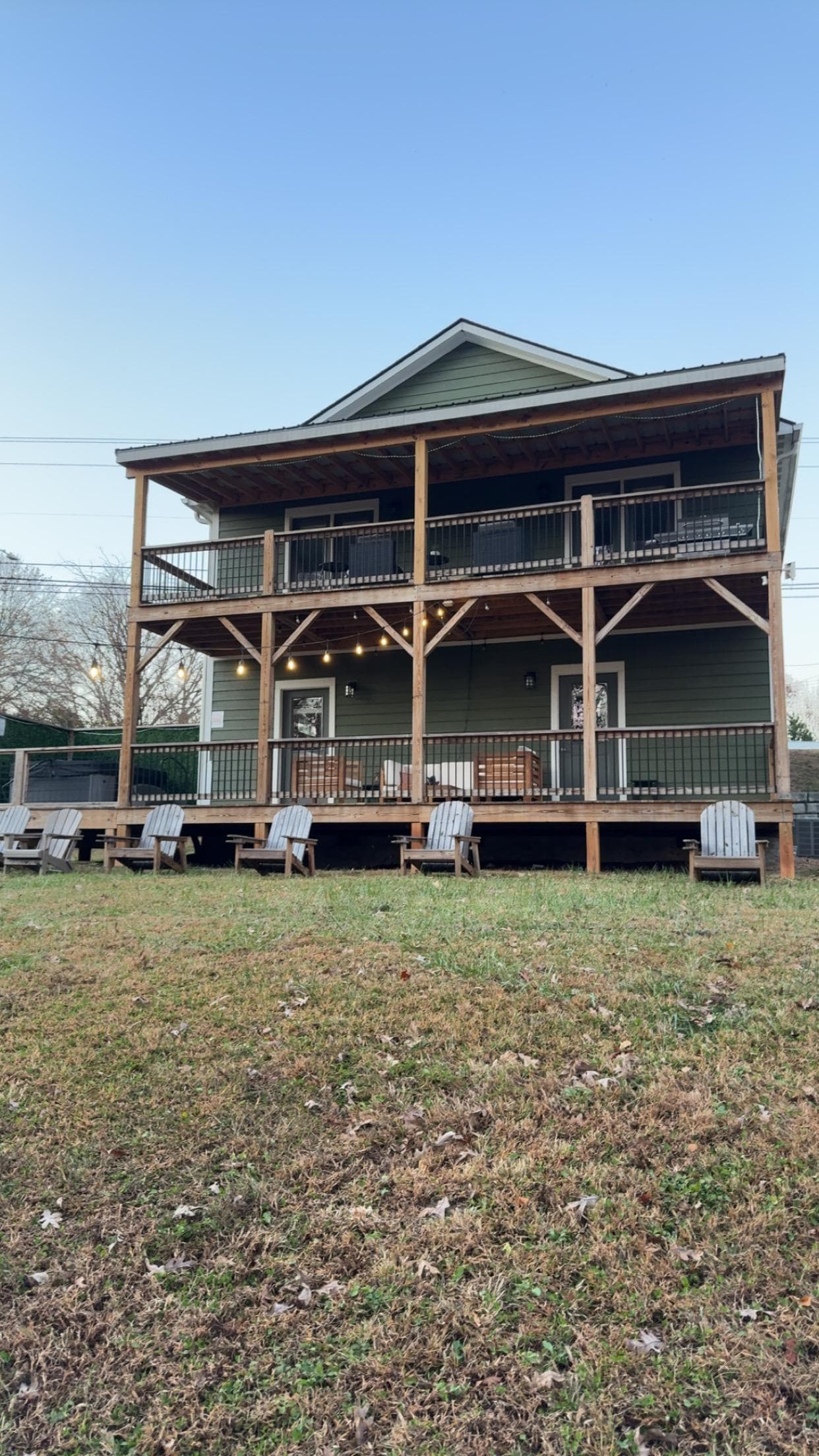 The backyard standing at the firepit.