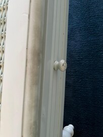 Edge of coffee table from people putting feet on it.