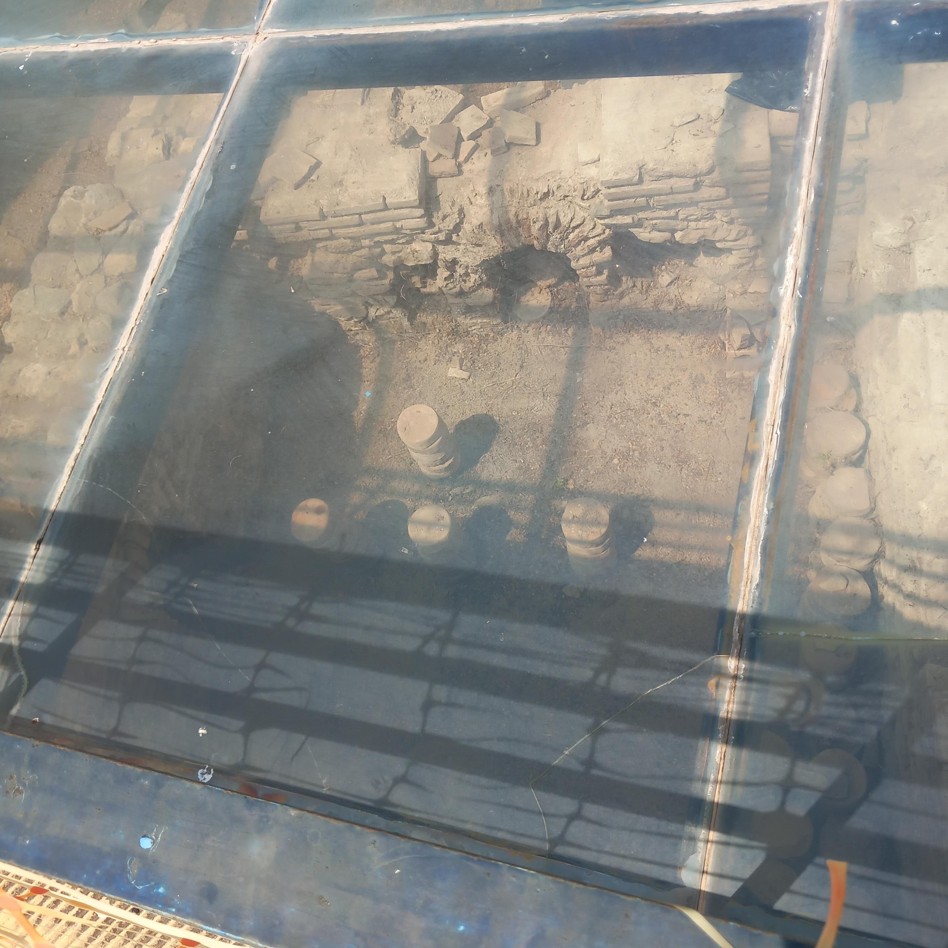 Ancient archeology outside supermarket.