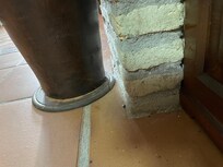 Dust and grime in corners and behind ornaments.