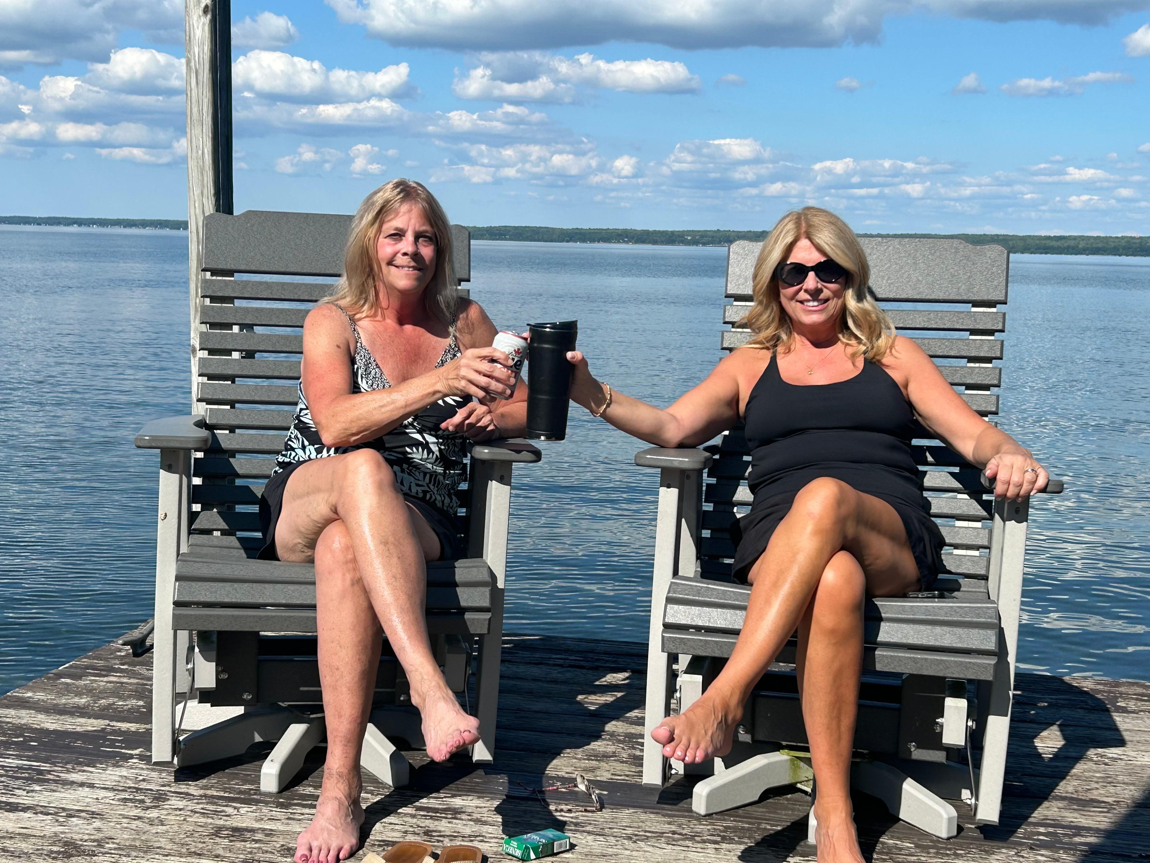Sisters enjoying a drink in the sun