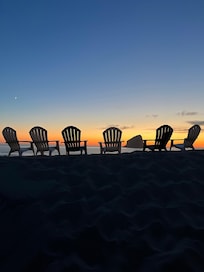 Chairs at the top of the sand dune