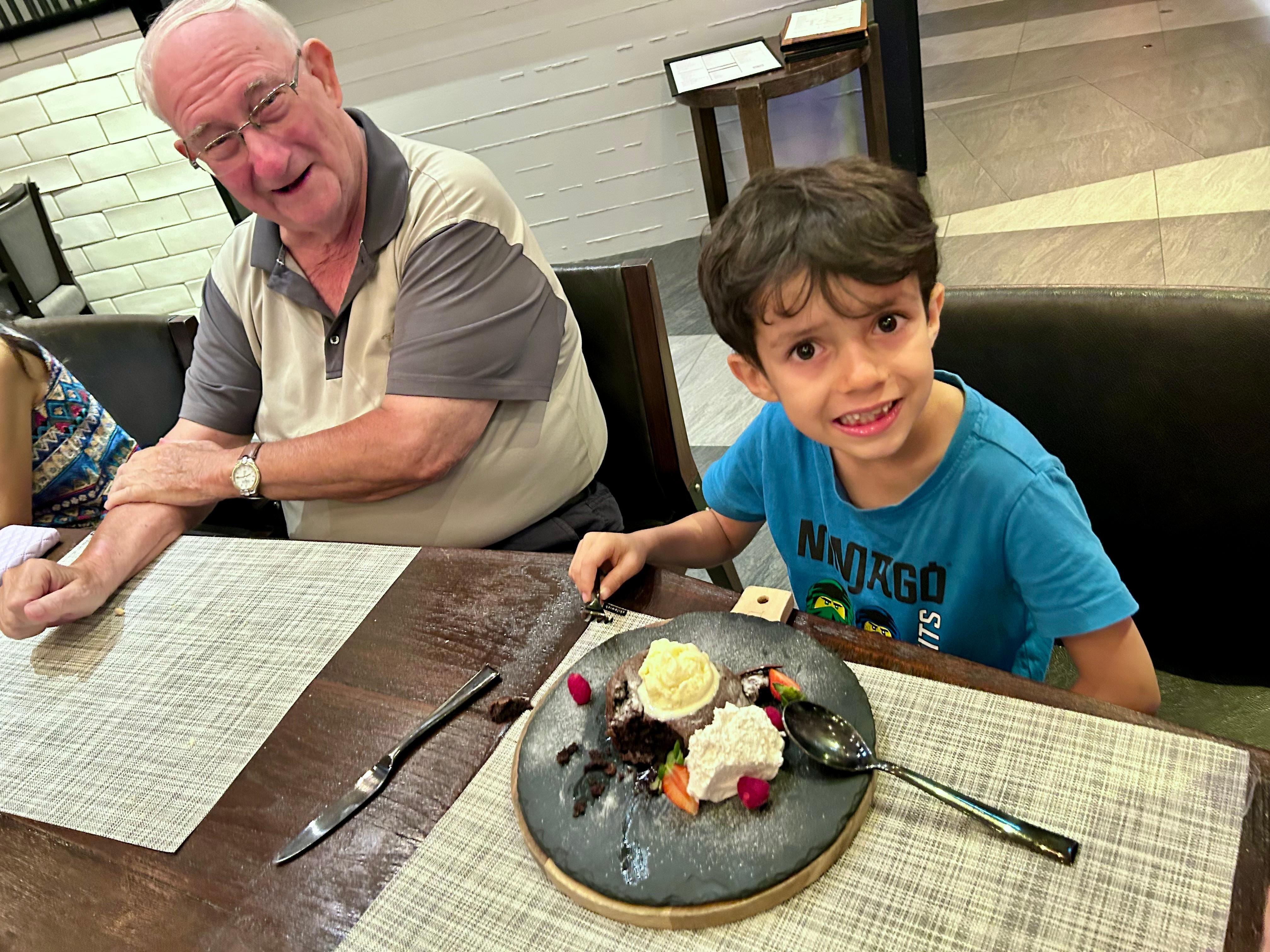 Enjoying a big lava cake with Grandpa