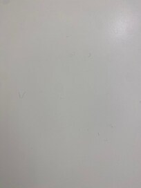 Hair left on the back of the bathroom door