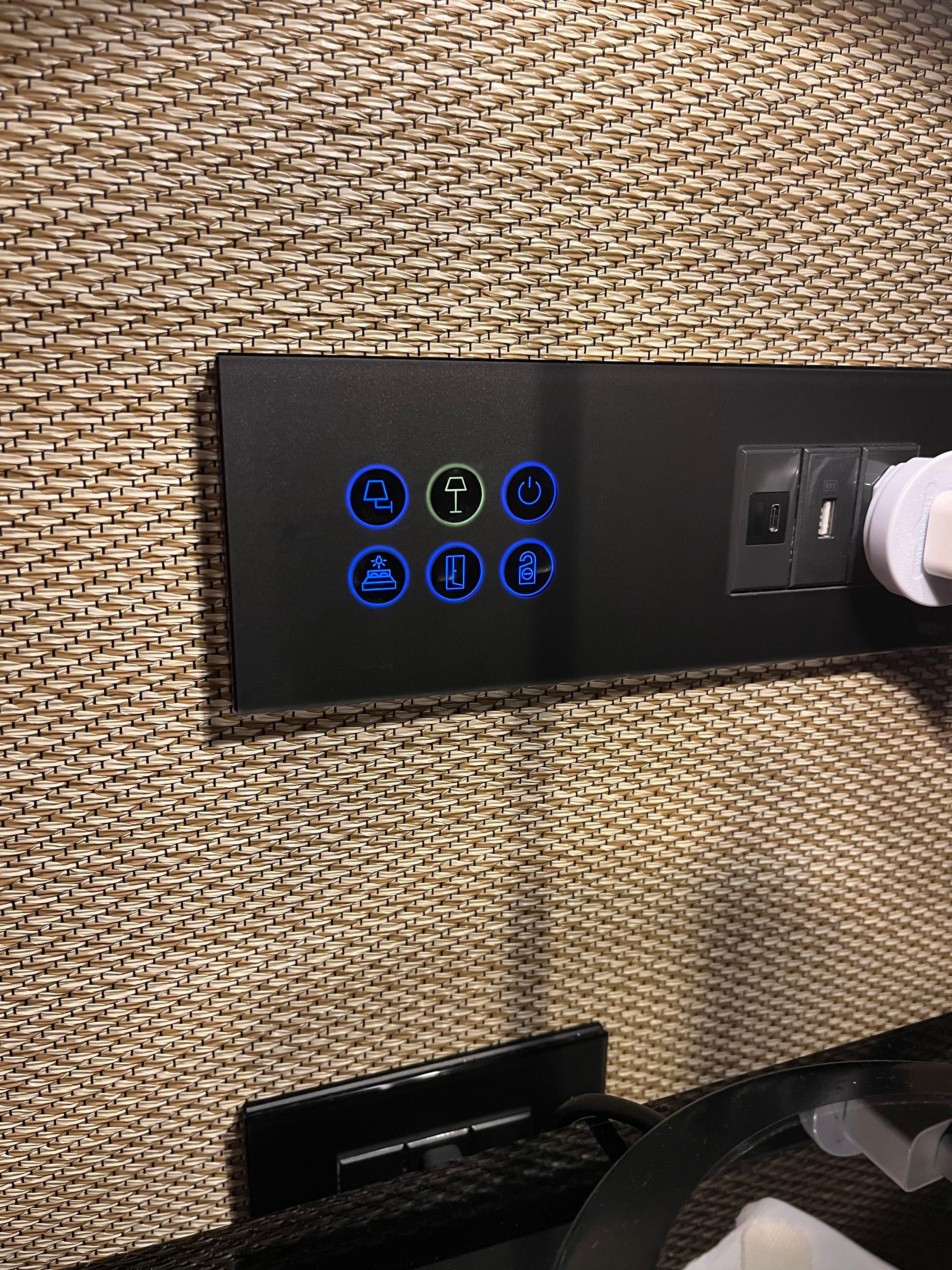 One-touch panel for lighting control beside the bed