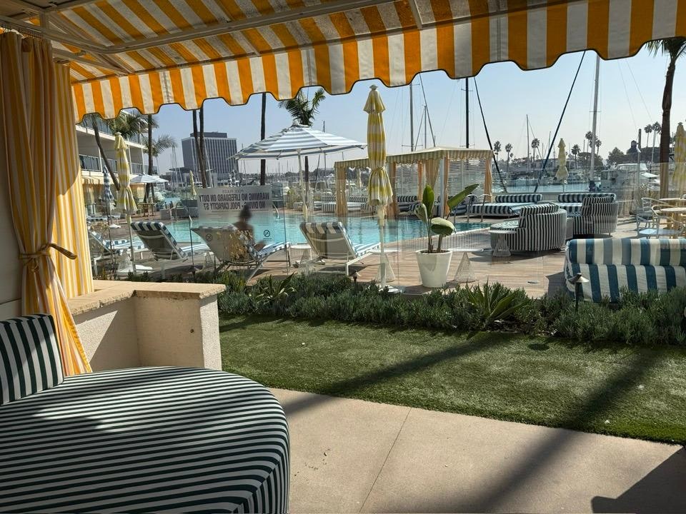 first floor queen room patio - with pool and marina view.