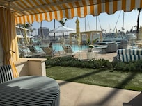 first floor queen room patio - with pool and marina view.