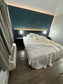 Bedside lighting is VERY bright (though soft back-lit headboard led light is nice!) Pillows and sheets are a little thin, but are comfortable and soft.