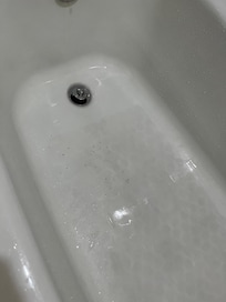 What is that black stuff that blew out of the faucet, mold, rust? The ceiling was so low I knocked loose a tile raising my arms to change shirts.