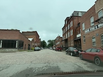 The street right in front of the apartment building. Beautiful step back in time with the redone buildings and brick road.