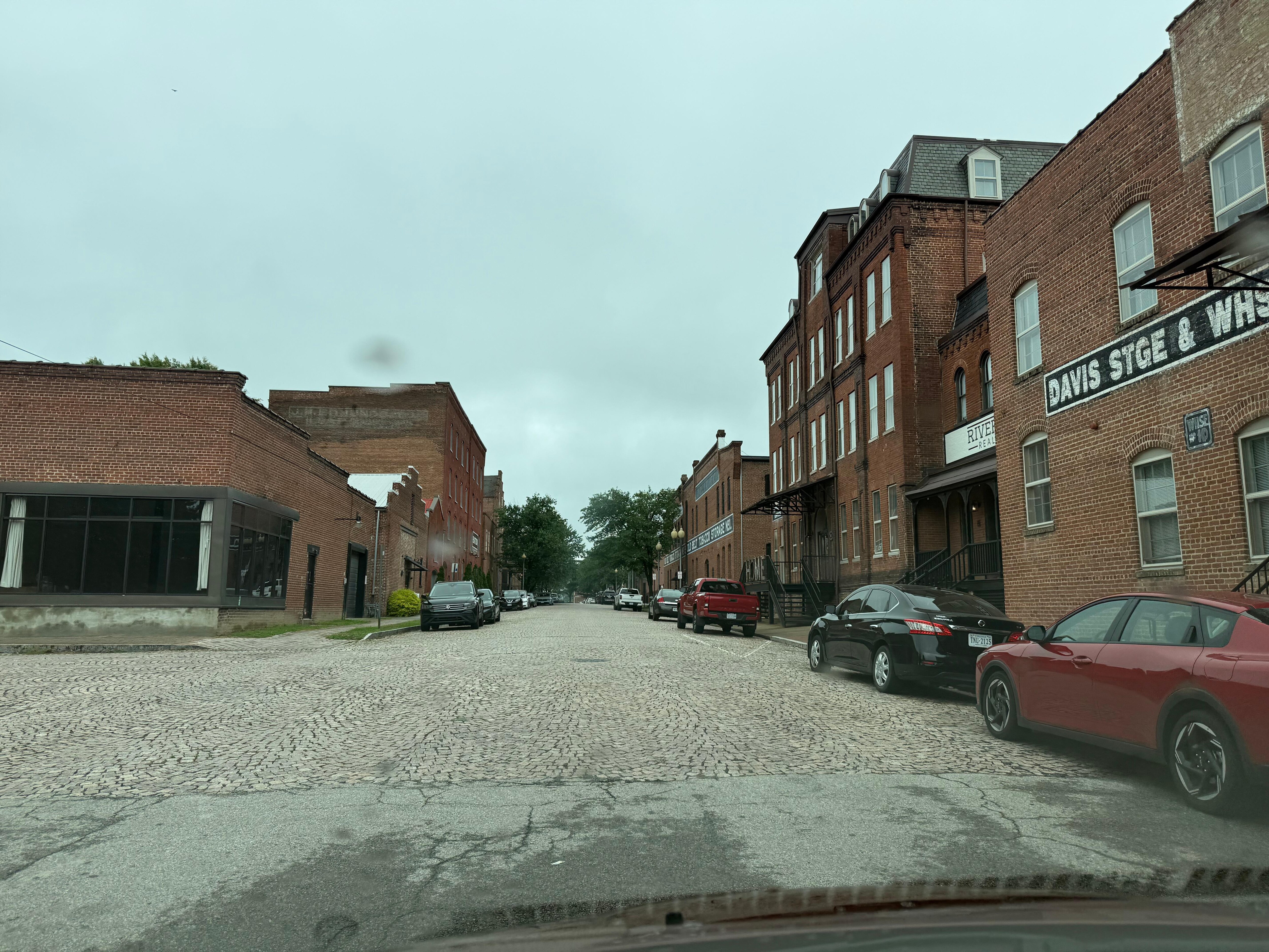 The street right in front of the apartment building. Beautiful step back in time with the redone buildings and brick road. 