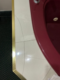 Tiles broken around the jacuzzi tub