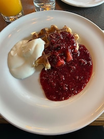 Waffle, berries and yoghurt for breakfast