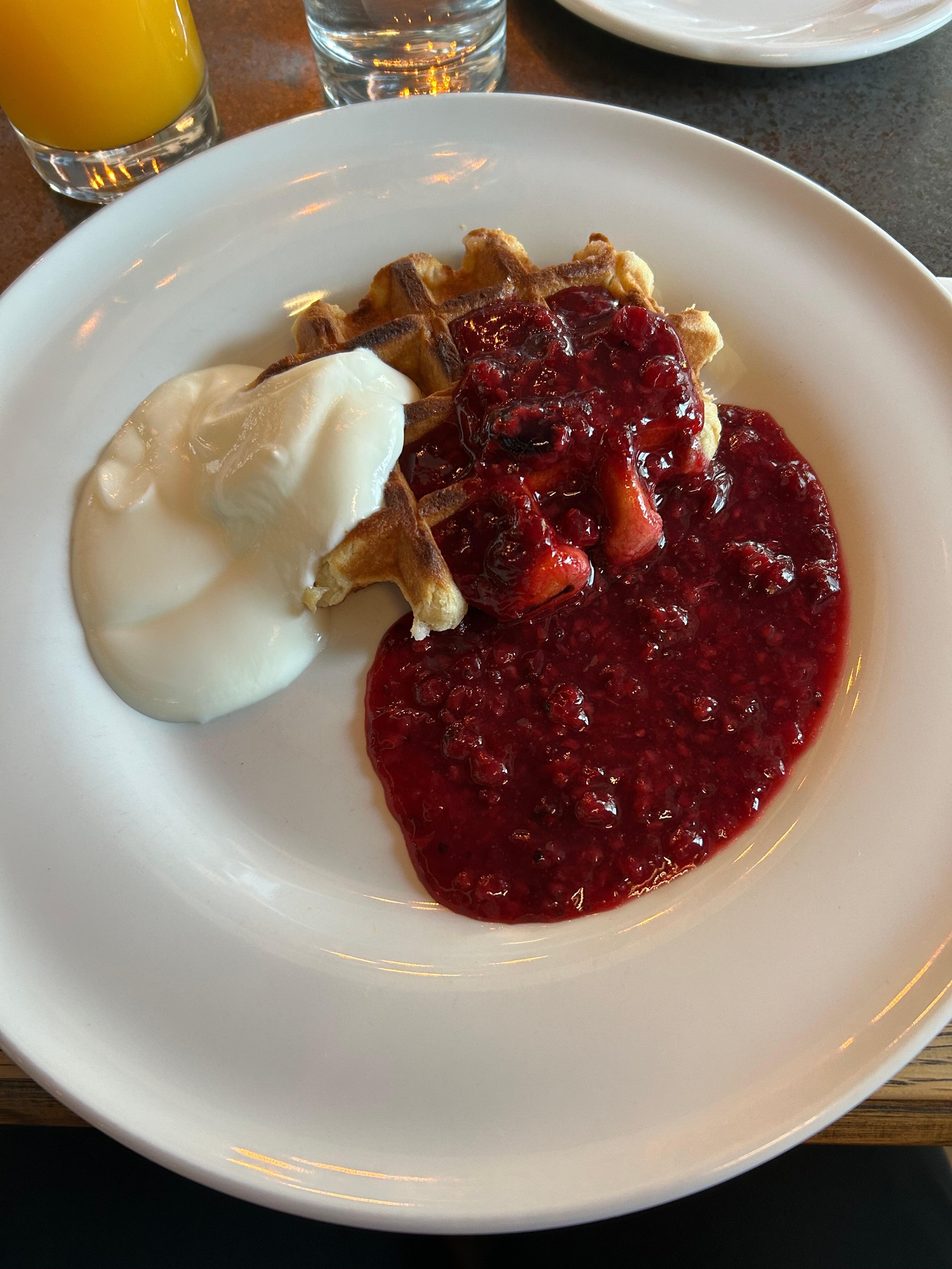 Waffle, berries and yoghurt for breakfast