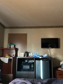 At first, I was really confused what the brown wooden piece of furniture was for. But after reviewing the hotel pictures, that is the piece of furniture the refrigerator and microwave used to be on.