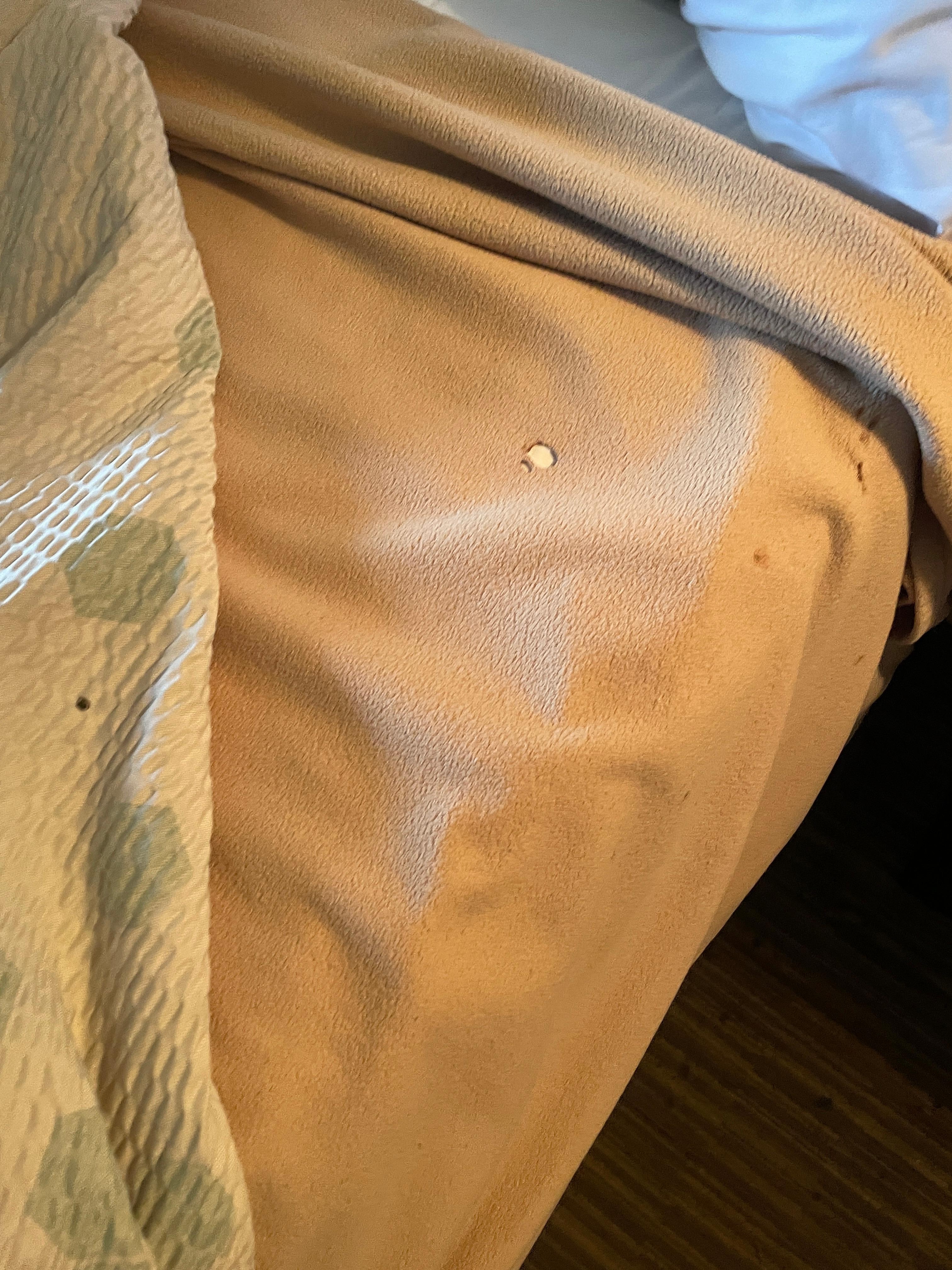Cigarette burns in linen