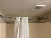 Shower curtain rod sagging in the center so the shower curtain would not stay stretched out when taking a shower