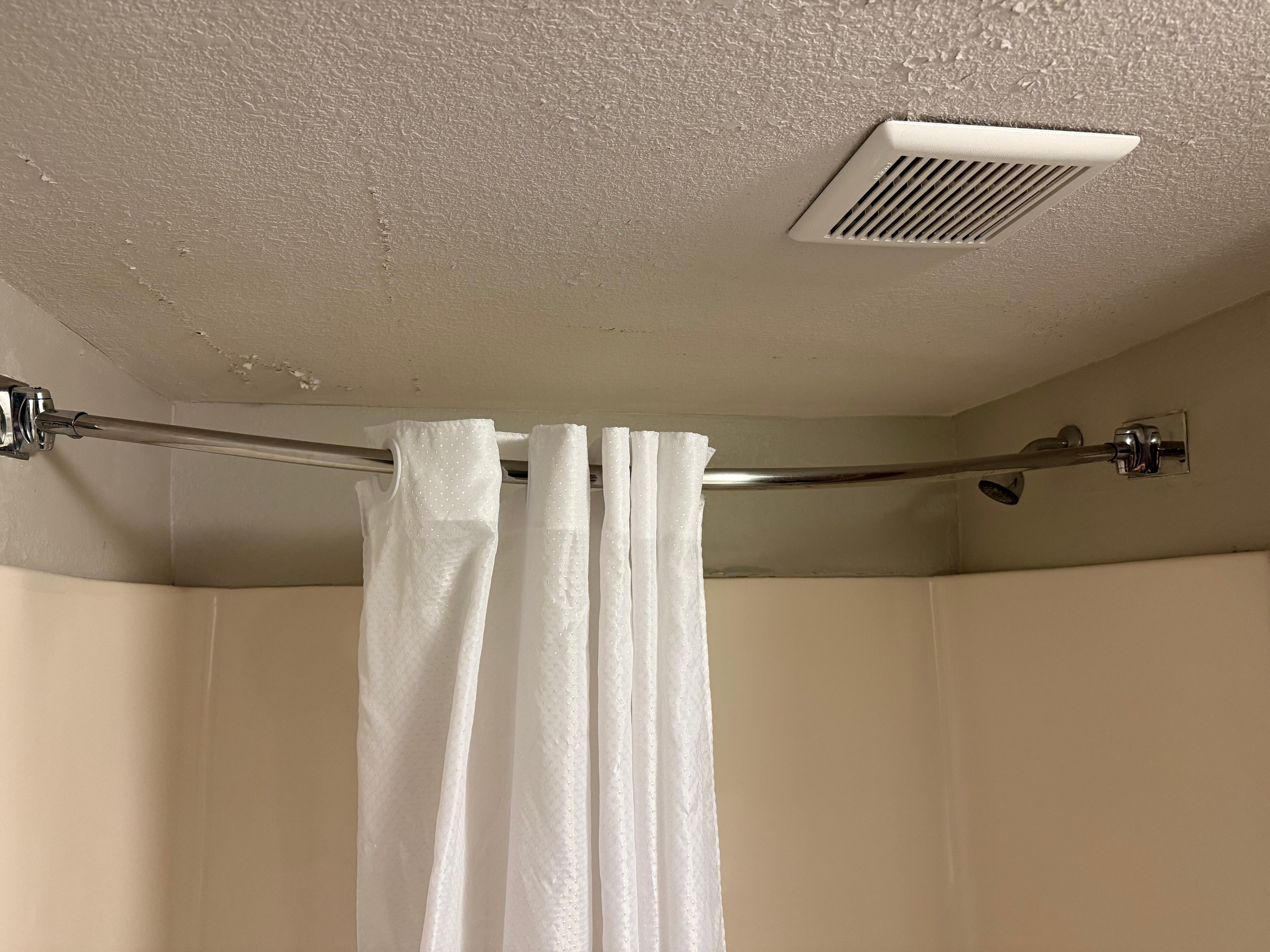 Shower curtain rod sagging in the center so the shower curtain would not stay stretched out when taking a shower 
