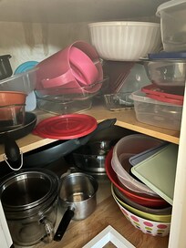 One of several packed kitchen cabinets