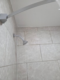 The shower head was leaking on top & the ceiling was getting moisture on it