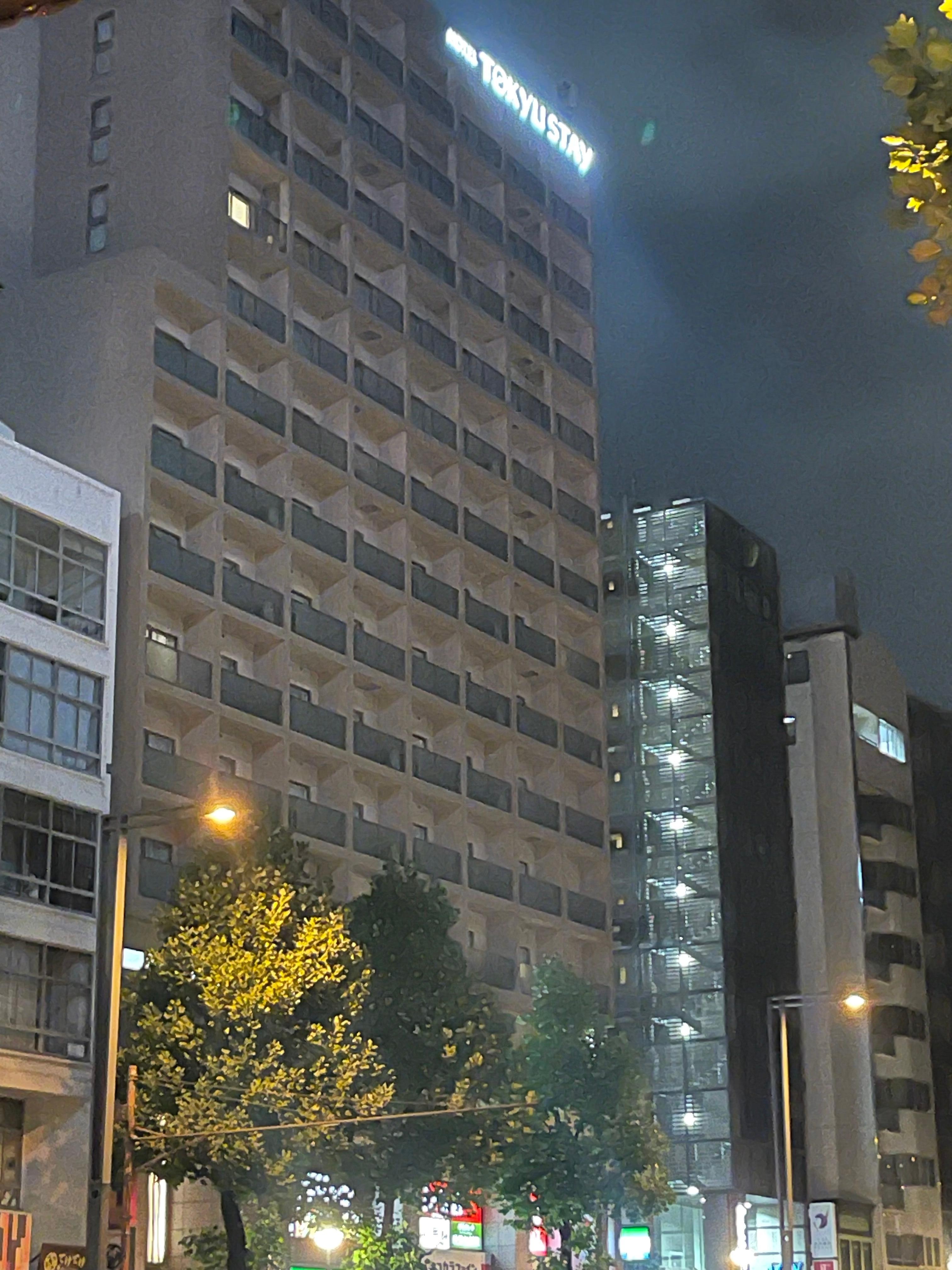 front of hotel with grocery, pharmacy and konbini all just a few steps from entrance