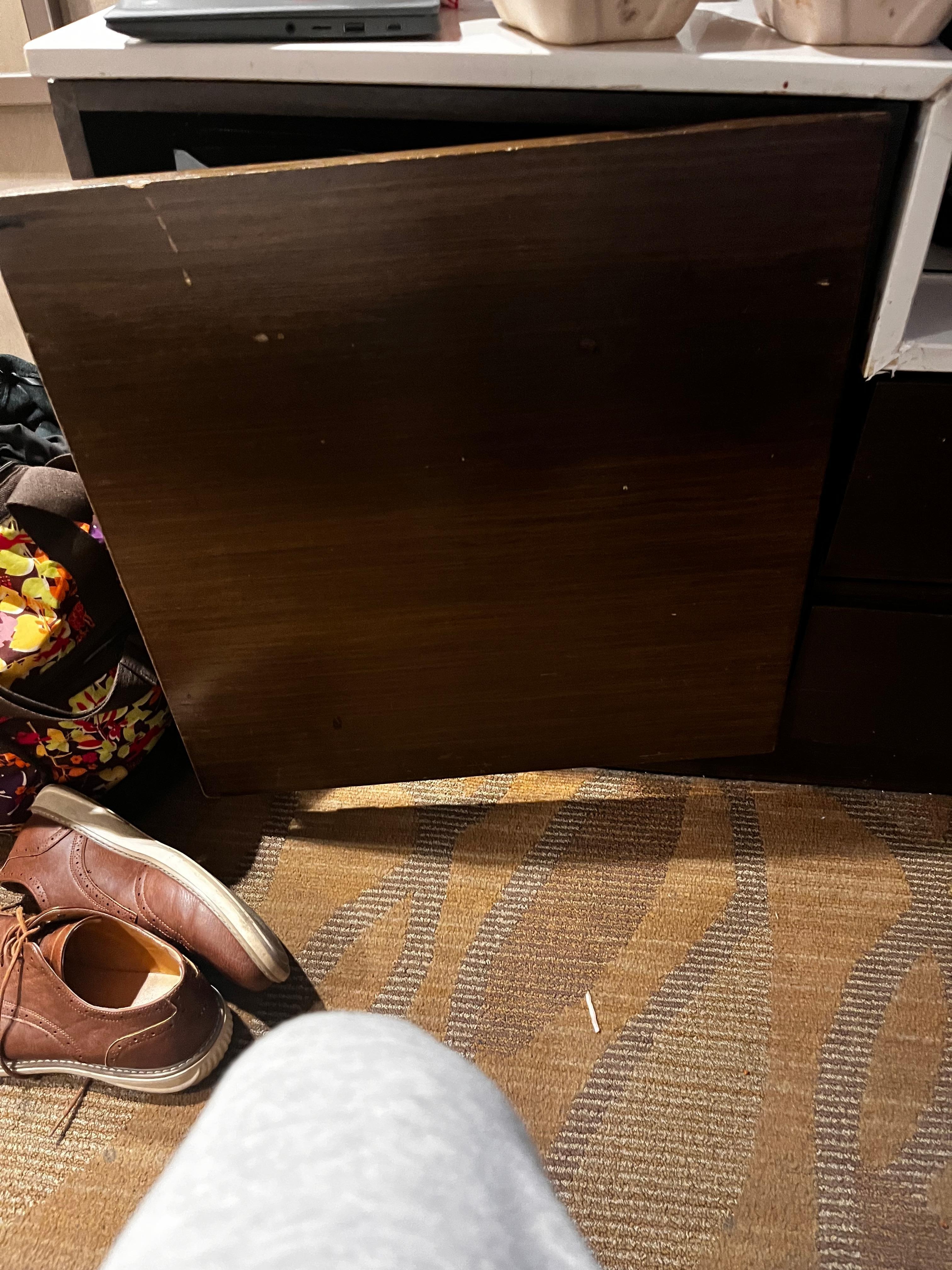 Cabinet where refrigerator is 