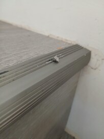 Stair tread nails sticking out.