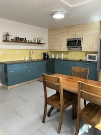 Beautiful spacious kitchen in the house. You will enjoy it.