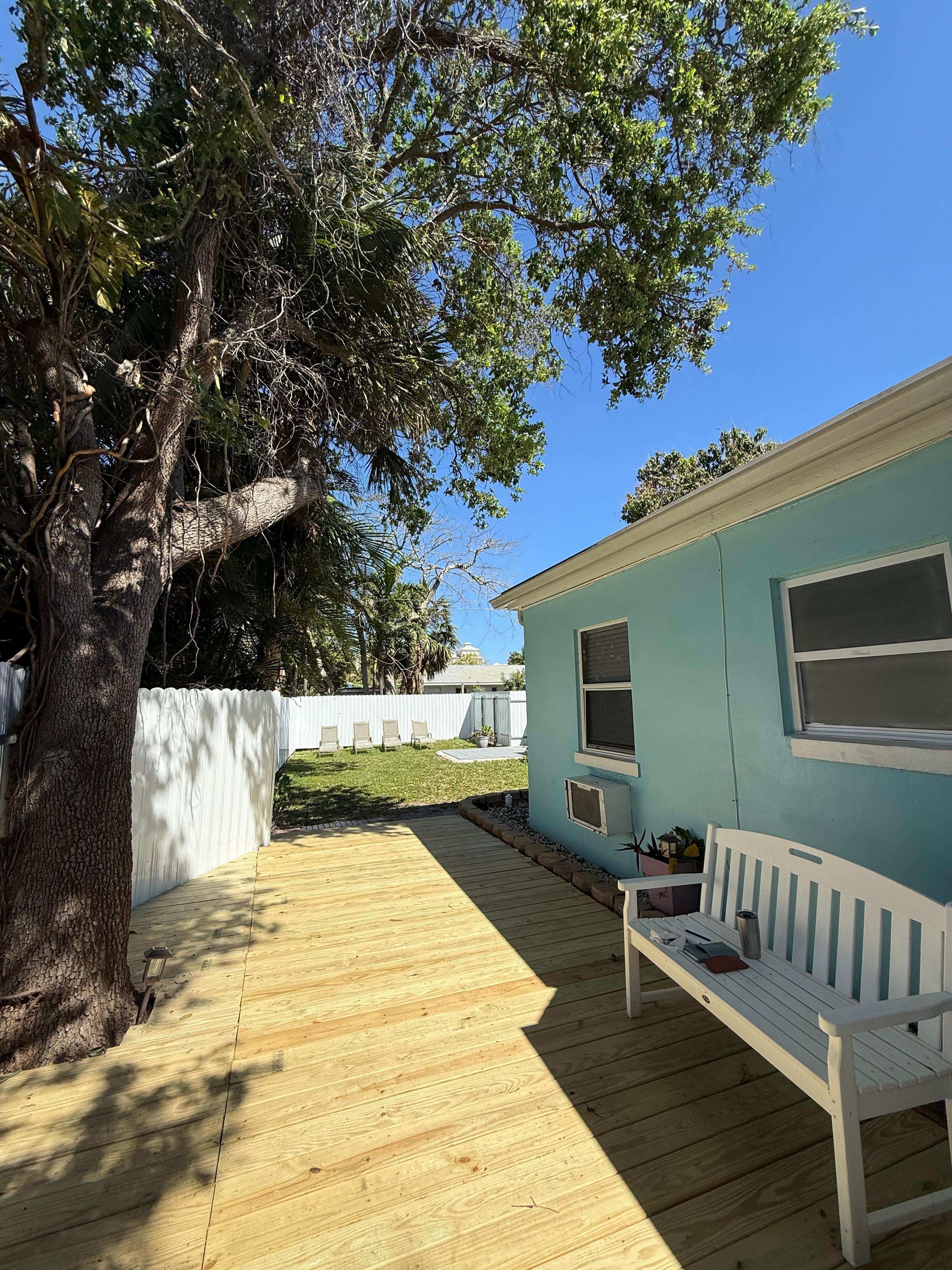 Back deck and backyard view. The deck has since been treated and painted. Looks fantastic. 