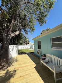 Back deck and backyard view. The deck has since been treated and painted. Looks fantastic.