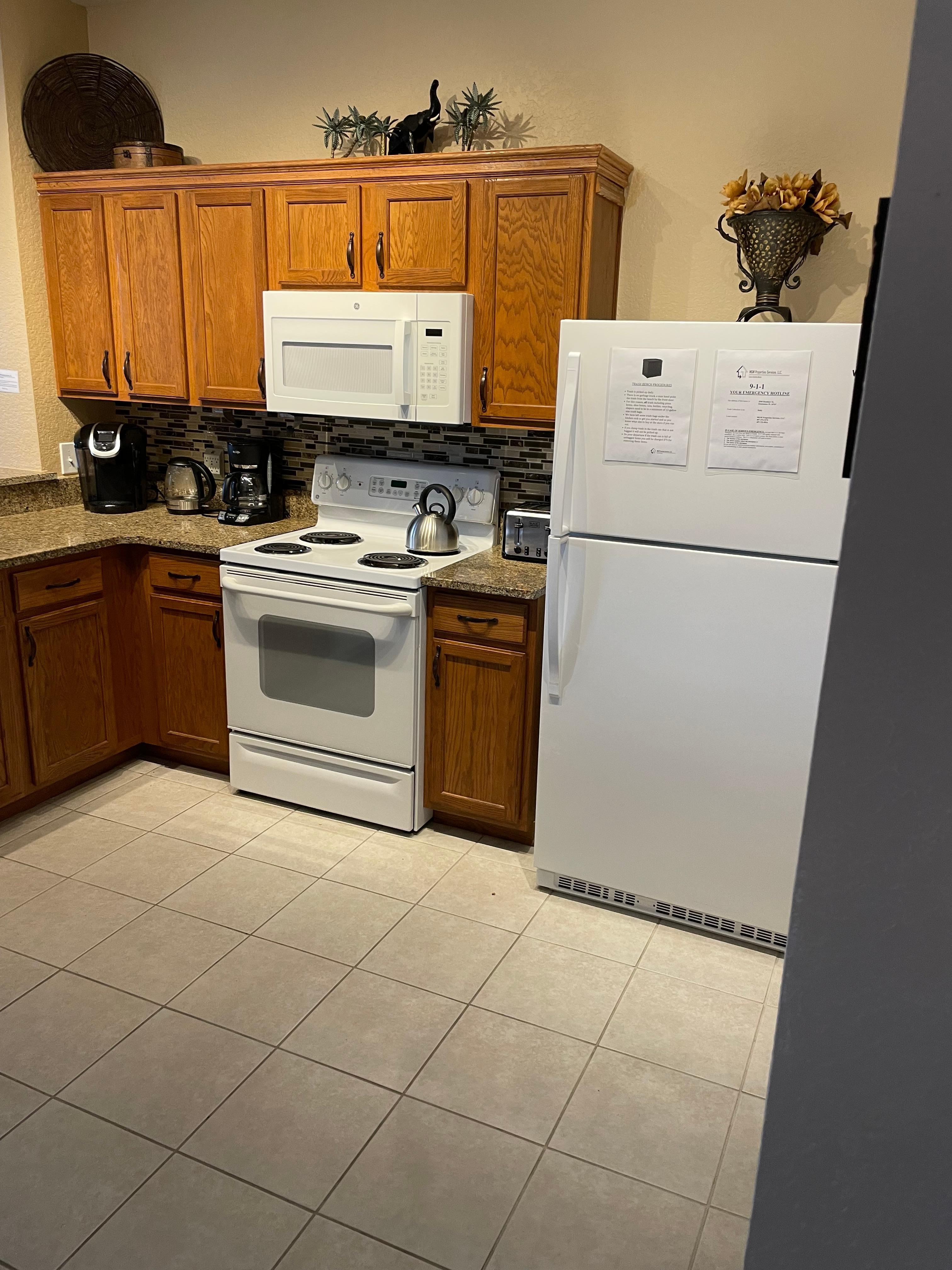Kitchen with appliances, we had to buy our own electric kettle as they only had a stove top that took ages to boil.