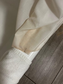 Mold and discoloration on base of shower curtain