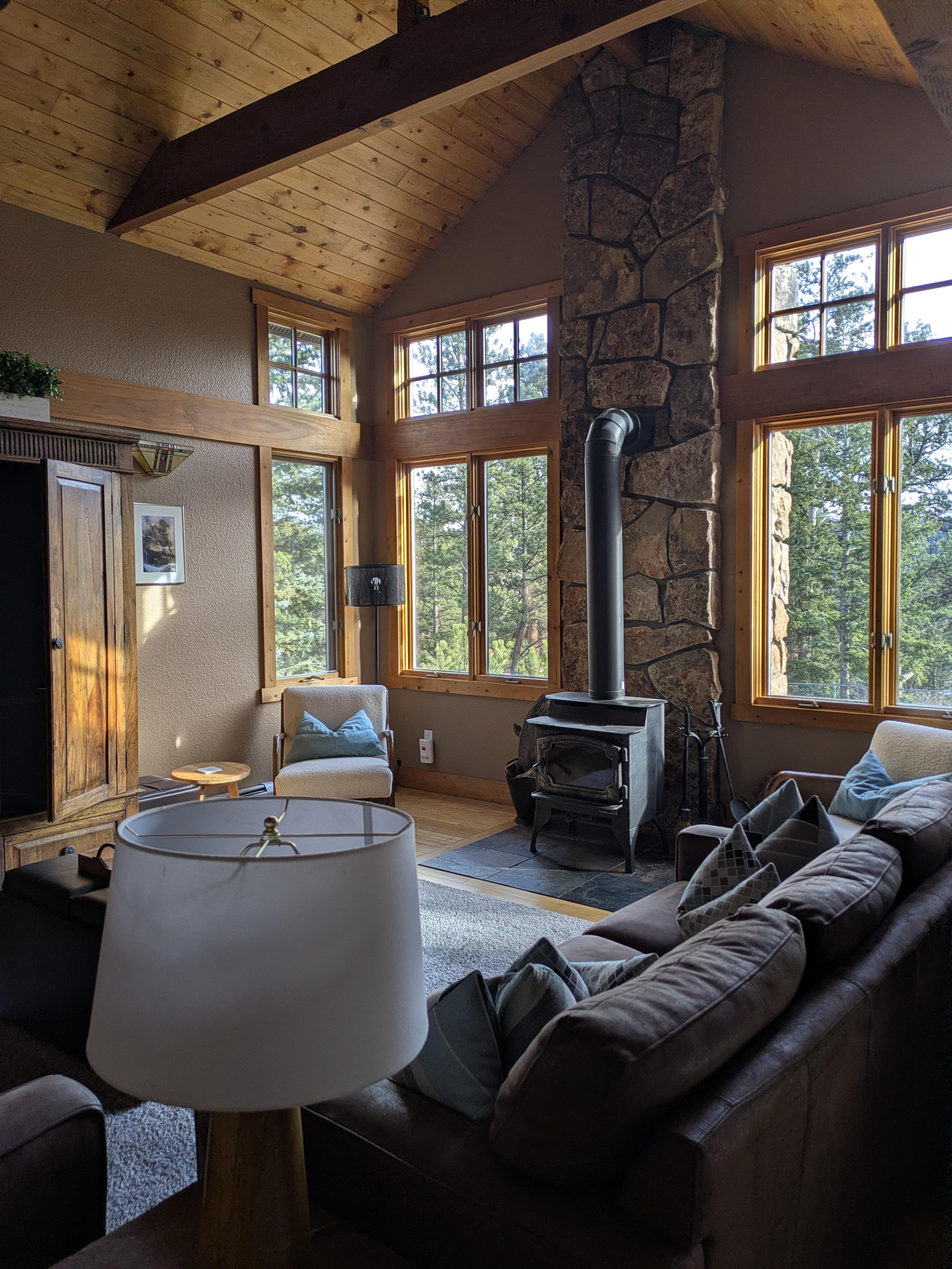 The main living area gives the feel of being away in the woods even though neighbors as nearby once you go outside.