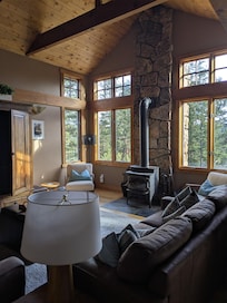 The main living area gives the feel of being away in the woods even though neighbors as nearby once you go outside.