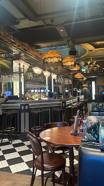 Barking George bar. There’s a phone in the hallway to ring for taxis.