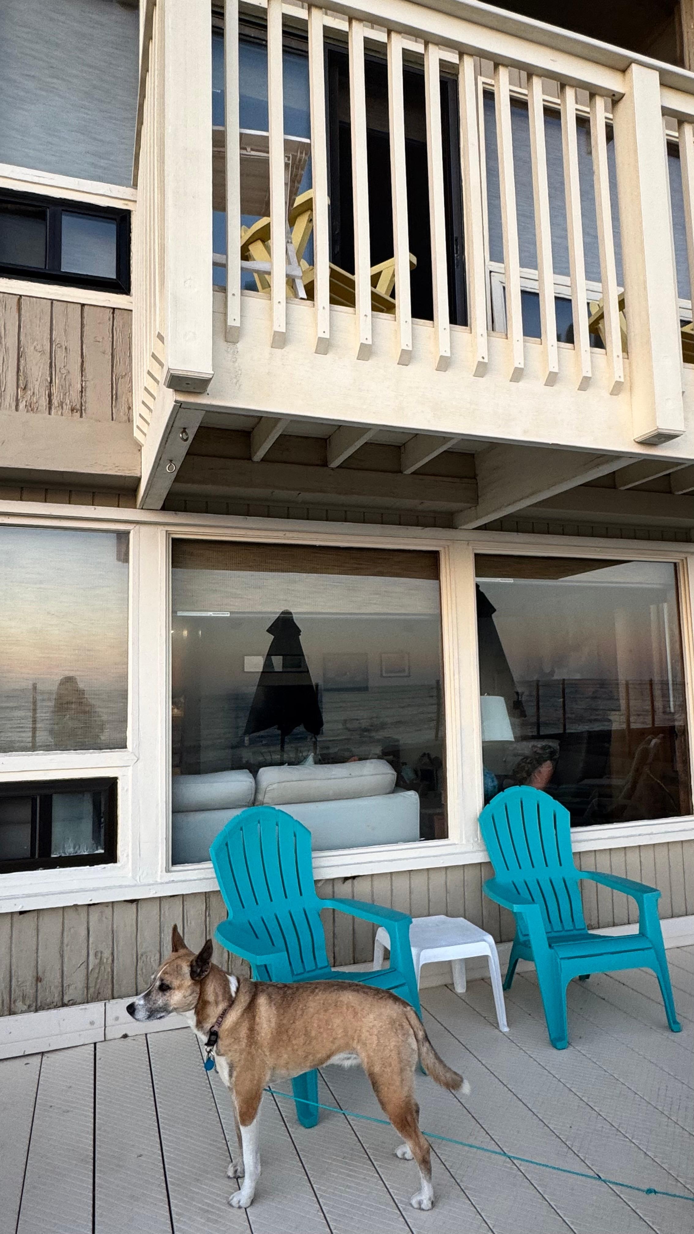 Upstairs balcony off the primary bedroom and deck below