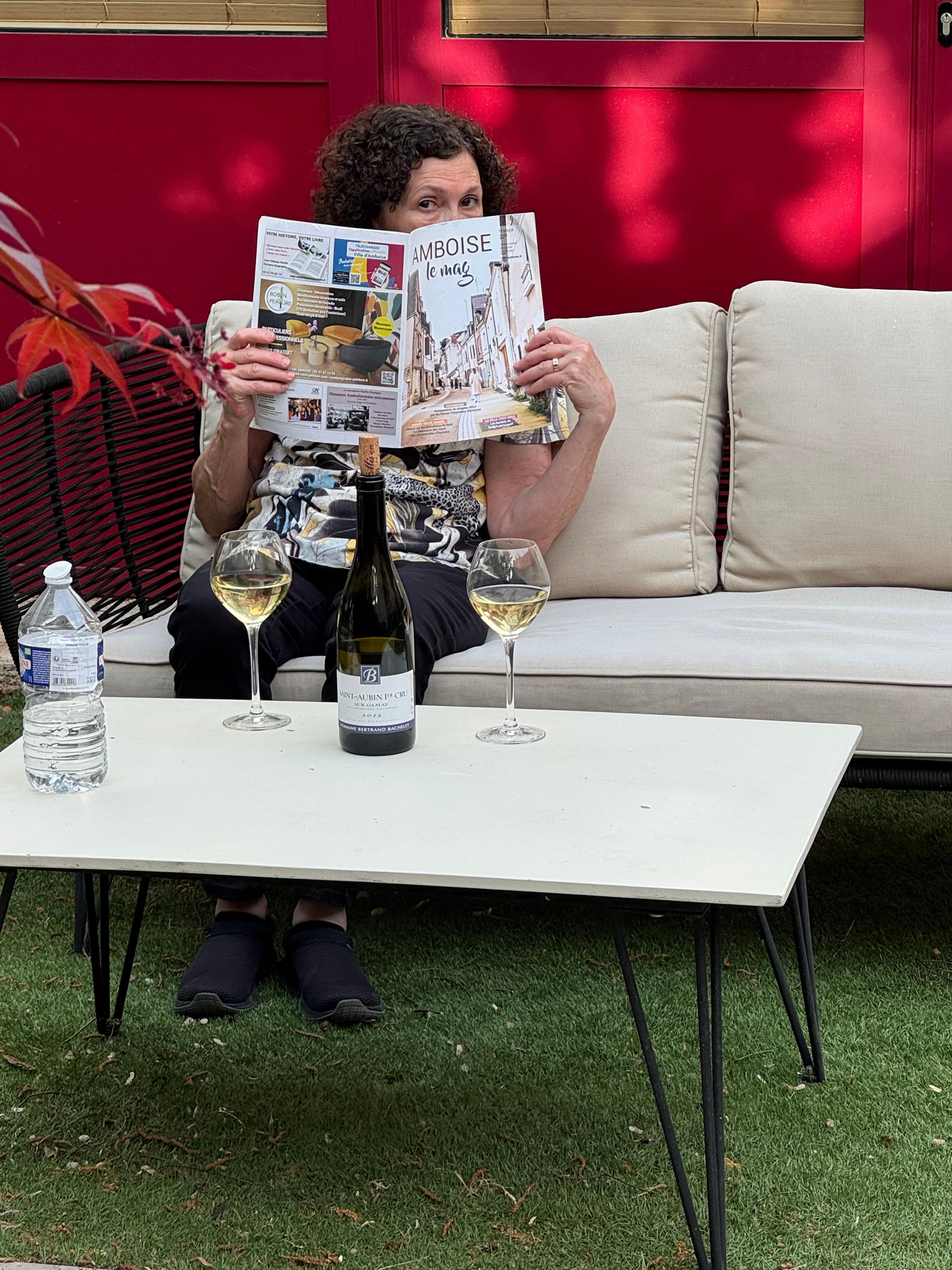 My wife enjoying a bottle of wine on the back courtyard on her birthday.